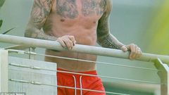 David Beckham shows off extensive tattoos on his balcony