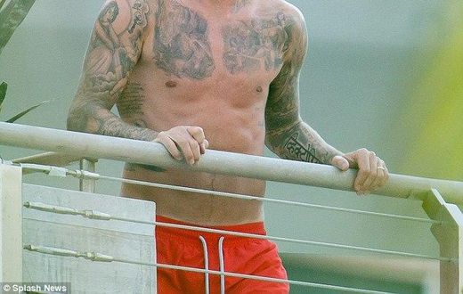 David Beckham shows off extensive tattoos on his balcony