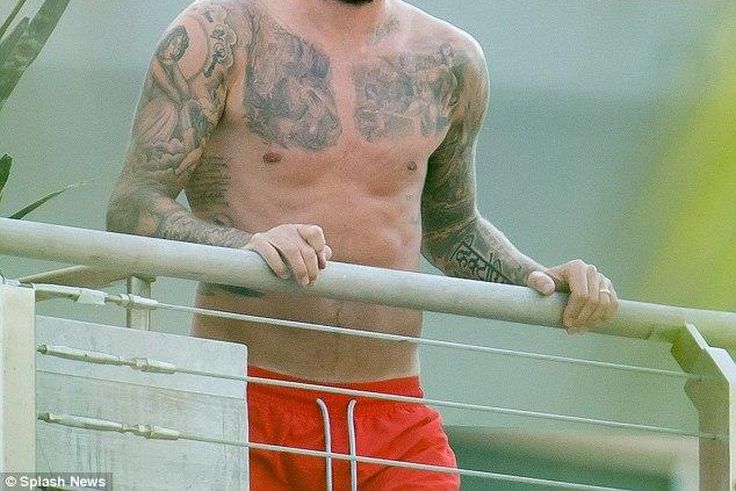 David Beckham shows off extensive tattoos on his balcony