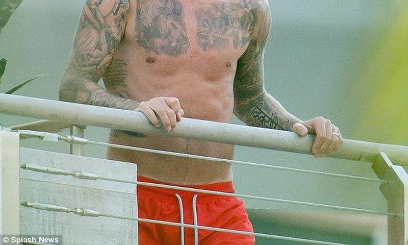 David Beckham shows off extensive tattoos on his balcony