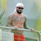 David Beckham shows off extensive tattoos on his balcony