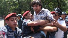 Armenian riot police earlier detained dozens of protesters and shortly released them [Getty Images]