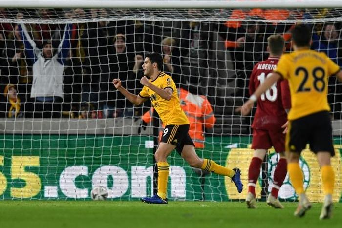 Raul Jimenez celebrates the opening goal as Wolves dumped Premier League leaders Liverpool out of the FA Cup with a 2-1 win on Monday