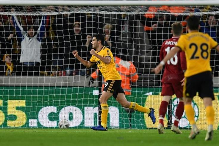 Raul Jimenez celebrates the opening goal as Wolves dumped Premier League leaders Liverpool out of the FA Cup with a 2-1 win on Monday