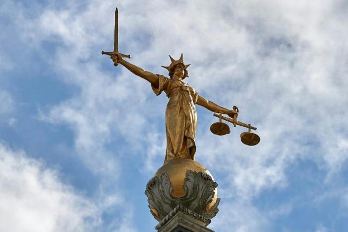 The "Lady of Justice" stands on the dome of the Central Criminal Court in London, commonly referred to as The Old Bailey, where a Ugandan woman was convicted of female genital mutilation