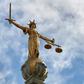 The "Lady of Justice" stands on the dome of the Central Criminal Court in London, commonly referred to as The Old Bailey, where a Ugandan woman was convicted of female genital mutilation