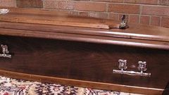 Dead woman comes back to life in a coffin.