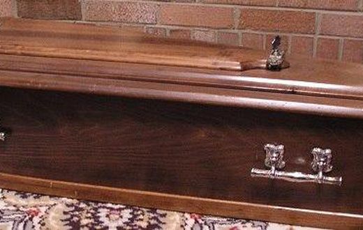 Dead woman comes back to life in a coffin.