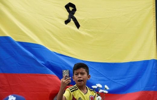 Thousands of people marched throughout Colombia on Sunday to condemn the car bombing, the deadliest attack with explosives in the city of Bogata since 2003
