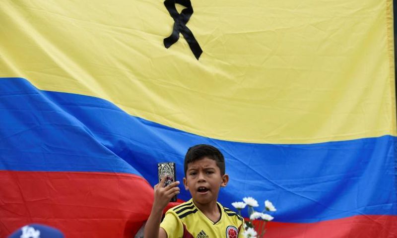 Thousands of people marched throughout Colombia on Sunday to condemn the car bombing, the deadliest attack with explosives in the city of Bogata since 2003