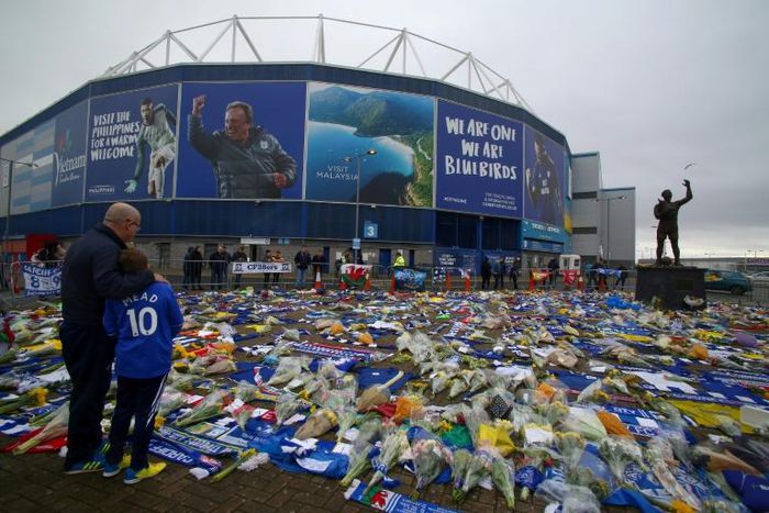 Fans have laid tributes to Emiliano Sala outside the Cardiff ground. Meanwhile the search for the player has resumed after a GoFundMe campaign