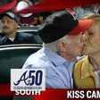 Former President Jimmy Carter kisses his wife Rosalynn on the “Kiss Cam” during a baseball game between the Atlanta Braves and the Toronto Blue Jays on Sept. 17, 2015