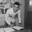 Zayn tweeted this photo of him signing a new deal with RCA