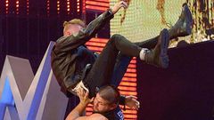 Machine Gun Kelly powerbombed off stage by Kevin Owens
