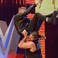 Machine Gun Kelly powerbombed off stage by Kevin Owens