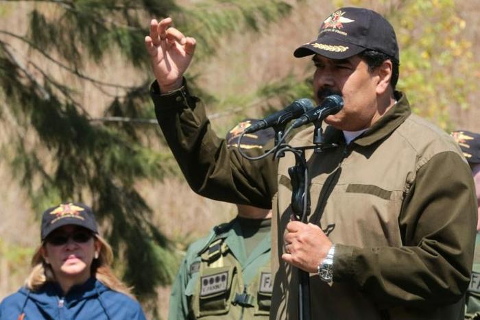 Venezuelan President Nicolas Maduro (R) is desperately trying to hold onto power in the face of opposition leader Juan Guaido's audacious bid to assume the country's top office on an acting basis