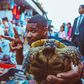 Usher Raymond displaying a turtle at a Moroccan market