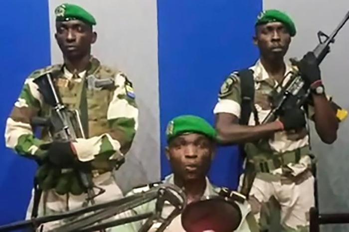 Three soldiers wearing the green beret of the Republican Guard were visible on a video of the speech circulating on social media