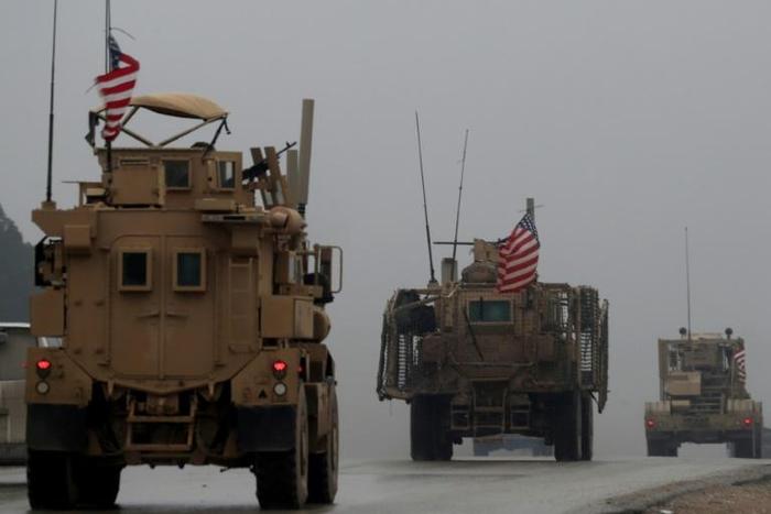 File picture taken on December 30, 2018, shows a convoy of US military vehicles in Syria's northern city of Manbij