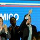 Venezuela's opposition leader and self-proclaimed "acting president" Juan Guaido (C) gives the thumbs-up as he prepares to present his "rescue plan" for the country