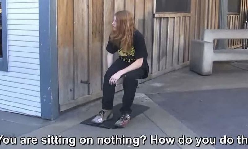 In this video, a man pretends to levitate in the air (sitting on an invisible chair).