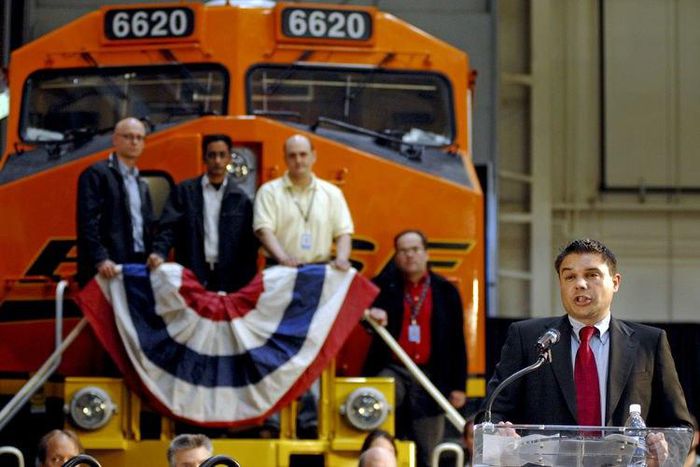 Lorenzo Simonelli speaking during the unveiling of a new fuel efficient and lower emissions locomotive at a GE plant
