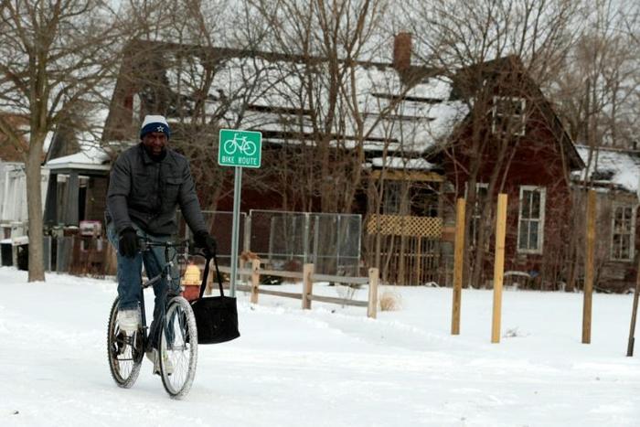 Jerry Jackson rides his bike in Detroit, Michigan -- the state has declared a emergency in view of the frigid temperatures