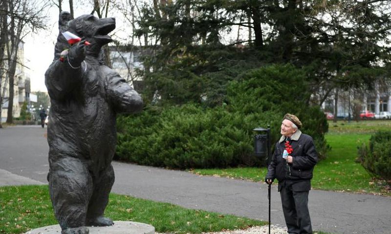 93-year-old former Polish soldier Wojciech Narebski with a monument to 'Corporal' Wojtek the bear, his wartime comrade in arms