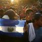 Migrants with an El Salvador flag headed to the United States