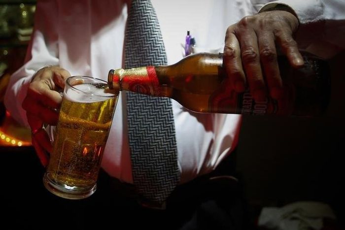 A bartender pours Haywards 5000 strong beer, a product of SABMiller in a file photo.  REUTERS/Danish Siddiqui