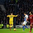 Salah strikes: Liverpool's Mohamed Salah celebrates opening the scoring against Brighton