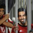 A fan wearing a mask of Egyptian football star Mohamed Salah poses for a photograph prior to the 2019 Africa Cup of Nations qualifier between Egypt and Niger on September 8, 2018 at the Borg el-Arab stadium near the Mediterranean city of Alexandria