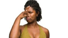 African woman covering her nose.