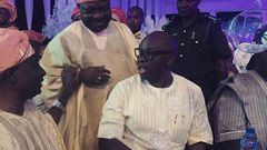 Senator Iyiola Omisore and Governor Fayose enjoy a quick chat while guests watched on