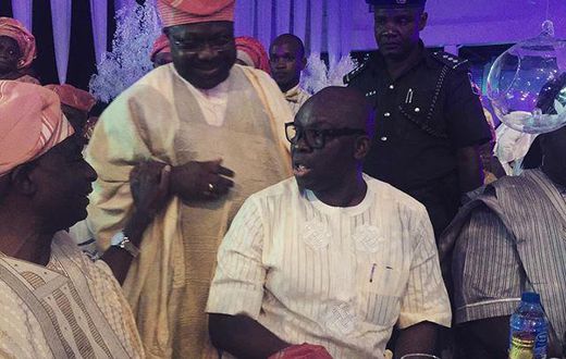 Senator Iyiola Omisore and Governor Fayose enjoy a quick chat while guests watched on