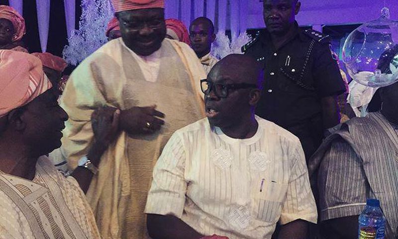 Senator Iyiola Omisore and Governor Fayose enjoy a quick chat while guests watched on