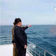 An image obtained by Yonhap News Agency shows North Korean leader Kim Jong Un pointing at a ballistic missile believed to have been launched from underwater on Saturday. 
