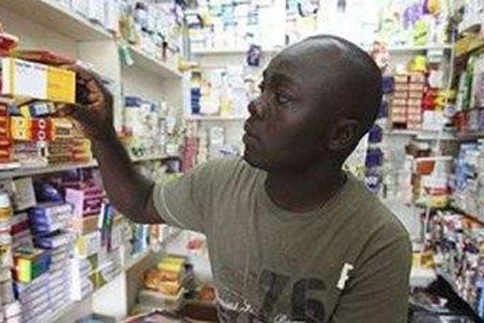 ___3818239___https:______static.pulse.com.gh___webservice___escenic___binary___3818239___2015___6___1___19___311012T.A+man+checking+anti-malaria+drug+in+a+pharmacy