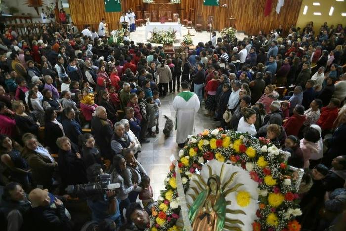 Relatives of three of the people killed in a massive blaze triggered by a leaky pipeline in Tlahuelilpan, Mexico attend their funeral on January 20, 2019
