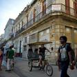 People walk past a building for sale in Havana, Cuba, as US Secretary of State Mike Pompeo warned foreign businesses to steer clear of formerly private properties seized by the island nation