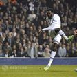 Tottenham Hotspur's Emmanuel Adebayor shoots wide of the goal during their Europa League soccer match against Benfica at White Hart Lane in London March 13, 2014. REUTERS/Dylan Martinez