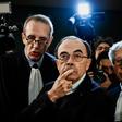Cardinal Barbarin flanked by lawyers as he arrives in court in Lyon