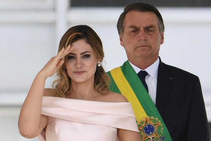 Brazilian authorities are to scrutinize the bank accounts of First Lady Michelle Bolsonaro (L) as part of a growing scandal over suspect payments involving the president's politician son
