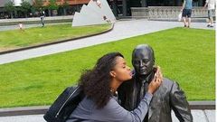 Dillish Matthews kissing a statue