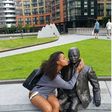 Dillish Matthews kissing a statue
