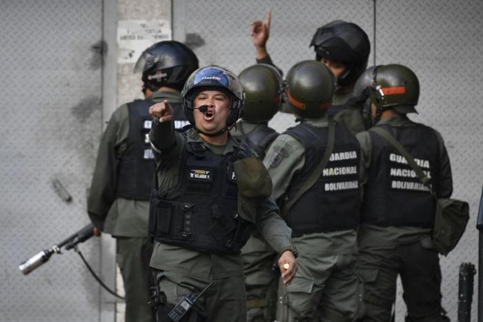 Soldiers from Venezuela's National Guard fired tear gas at protesters near the Cotiza command post taken over by rebel troops aiming to overthrow President Nicolas Maduro on January 21, 2019