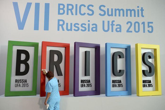 An employee cleans a board during the preparations for the BRICS summit in Ufa, Russia, July 7, 2015. REUTERS/BRICS Photohost/RIA Novosti