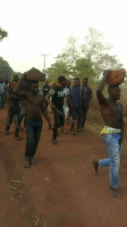 Instant justice: Thieves paraded with rocks on their heads as residents whip them