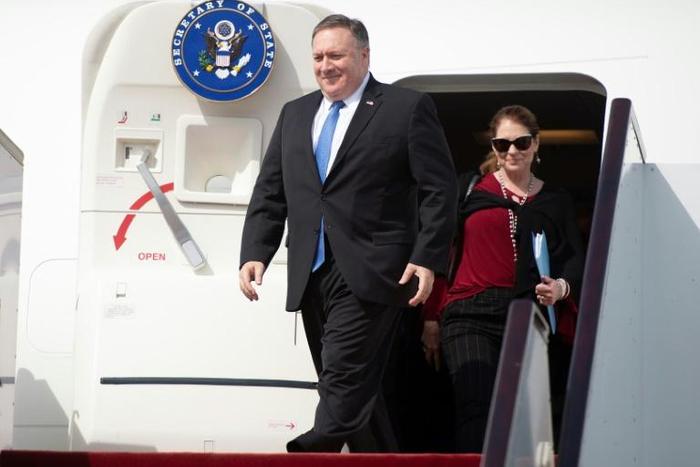US Secretary of State Mike Pompeo and his wife Susan arrive at Doha International Airport on January 13, 2019