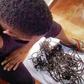 Timaya displaying his shaved dreadlocks
